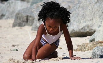Girl playing on the beach