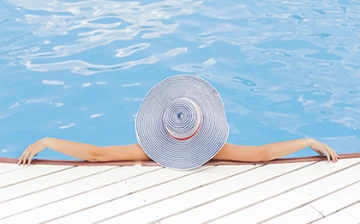 Women relaxing in swimming pool