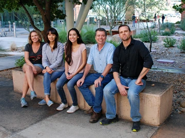 McKay Lab team sitting on a bench