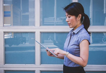 Woman walking while she works