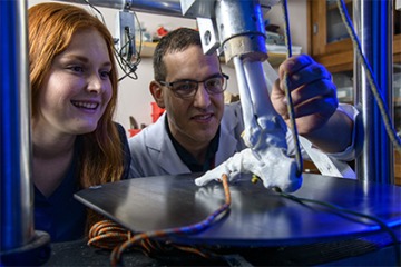 Physiology major Mikayla Campagne and David Margolis, MD, PhD, assistant professor of orthopaedic surgery, study the effects of antibiotics on the Achilles tendon.