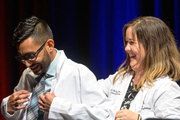 (From left) Eddie Vargas is a first-generation college student and Tucsonan who earned his bachelor’s degree in neuroscience and cognitive science from the University of Arizona before enrolling in medical school in the College of Medicine – Tucson. On the right is his mentor Joy Bulger-Beck, MD, clinical assistant professor in the College of Medicine – Tucson.