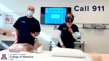 Staff at the College of Medicine – Phoenix Center for Simulation and Innovation demonstrate giving chest compressions to the beat of music.