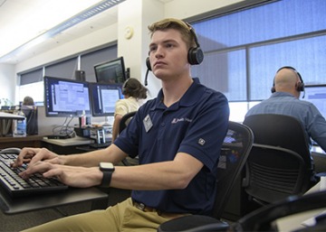Briggs Carhart, a master’s degree student in public health, helps the Arizona Poison and Drug Information Center field the hundreds of daily calls they receive from people worried about the COVID-19 pandemic.