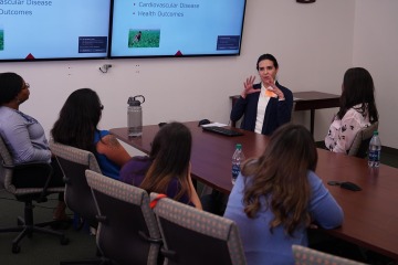Nursing’s PhD program and its research work attract professionals from a wide swath of health care professions and other backgrounds. Pictured: a 2018 presentation.