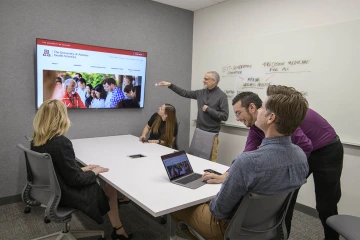 Inside a small meeting space in the Faculty Commons + Advisory.