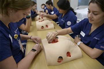 In addition to their work with live patients, UArizona College of Nursing students get plenty of experience poking and prodding simulated models of human patients.