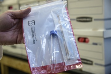 A completed COVID-19 sample collection kit.