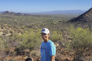 Dr. Nuño, pictured wearing an Adelante, Nuestro Futuro T-shirt on a hike in Tucson, says she finds being in nature a grounding experience. (Photo courtesy Velia Leybas Nuño)