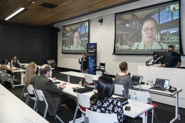 Caroline Berger spoke at the December 2021 Health Tech Connect event, which included both in-person and virtual participants.