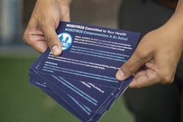 Flyers for Nosotros Comprometidos a Su Salúd, or We’re Committed to Your Health, ready for hand-out to passersby at the Tanque Verde Swap Meet on Tucson’s south side.