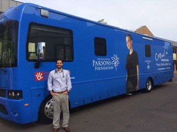 Gary Kirkilas, MD stands in front of the Mobile Health Unit he uses to reach homeless and disadvantaged communities. Dr. Kirkilas practices pediatrics at Phoenix Children’s Hospital.