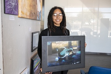 Sydni Wooten and her art “Planetary Migration”Wooten works in Information Technology for the University of Arizona Health Science—Phoenix. 