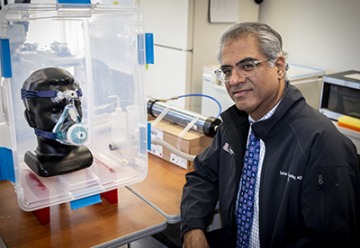 Sairam Parthasarathy, MD, pictured with an early mask prototype, is independently working on a mask that utilizes FDA-approved parts.