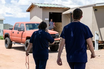 Dr. Hunt and medical student Jeremy Winkleman make a home visit to check on a patient and her new daughter. 