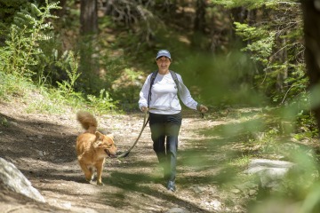 Cynthia Thomson, PhD, walks her dog. Exercise recommendations are more specific in the latest update to the American Cancer Society’s prevention guidelines.