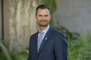 Photo of man wearing a suit.