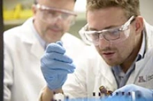 Christopher Hulme, PhD, oversees staff working on medicinal research in his laboratory. (Photo: University of Arizona Health Sciences)