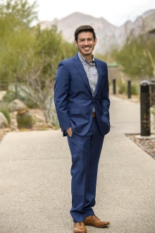 Portrait of David O. Garcia, PhD, from the University of Arizona Mel and Enid Zuckerman College of Public Health standing outside