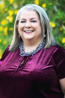Portrait of Dr. Teshia Solomon in an outdoor setting.