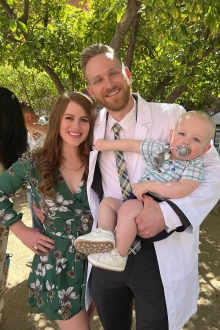 Christian Suyat (middle) with his partner, Kelsey, and their 1-year old son, Kellen, at the R. Ken Coit College of Pharmacy White Coat Ceremony. 