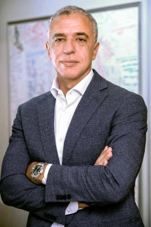 Portrait of Dr. Hesham Sadek, wearing a business suit.