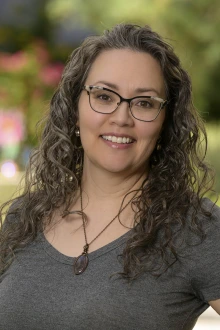 Portrait of Marianna Holland, DNP, standing outside smiling.