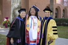 Two U of A College of Nursing faculty members pose with a graduating student after the college’s convocation ceremony. Angela Acuna, flanked by nursing faculty members Sharon Hom, PhD, RN, and Timian Godfrey, DNP