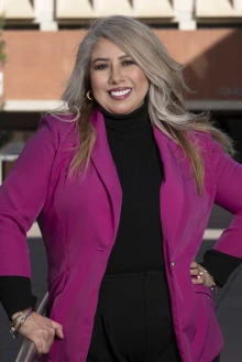 Portrait of Raquel Givens standing outside smiling. 