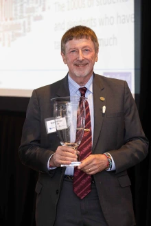 Photo of Dr. Katz holding his award.