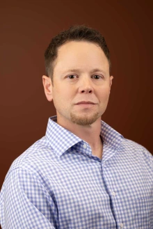 Portrait of professor and researcher Noel Warfel, PhD
