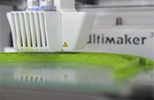 A face shield headband is produced on a 3D printer. (Photo: Kris Hanning, University of Arizona Health Sciences)