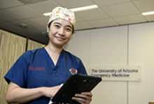 Holding a bedside ultrasound device, Elaine Situ-LaCasse, MD, a UArizona College of Medicine –Tucson assistant professor and National Foundation of Emergency Medicine scholar, won a grant to train rural providers on lung ultrasound as a quicker, more efficient way to evaluate patients who may suffer from COVID-19. (Photo: University of Arizona Department of Health Sciences, Kris Hanning)