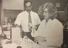 A researcher watches over a lab assistant in one of the original Skaggs Center laboratories.