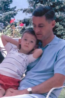 Three-year-old Dr. Nikolich-Žugich sitting on his father’s lap during a family vacation in France