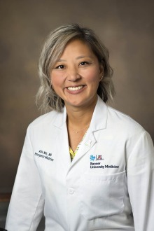 Portrait of Dr. Allie Min wearing a white coat