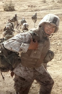 Marine soldier walking wearing camouflage gear