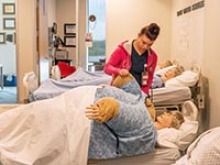 A BSN-IH student uses the simulation space at the Gilbert campus in November 2019. (Photo: University of Arizona College of Nursing)