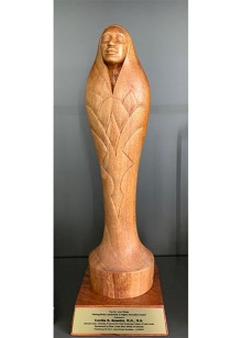The Dr. Loui Olivas Distinguished Leadership in Higher Education Award is a woodcarving made by Phoenix-based, internationally acclaimed artist Zarco Guerrero.