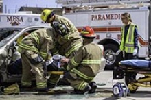Paramedics attend to a traumatic brain injury victim during a simulated crash at the City of Mesa Public Training Facility in May 2019. (Photo: Sun Belous, University of Arizona College of Medicine – Phoenix)