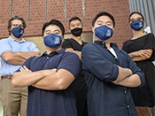 Dr. Eugene Chang (middle back) with his lab staff: Joey Irish, Ray Lee, Eric Lee and Sunny Palumbo outside the Medical Research Building on the UArizona Health Sciences Campus in Tucson. (Photo: Kris Hanning/University of Arizona Health Sciences)