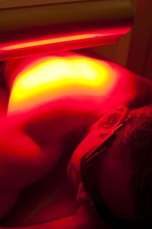 Phototherapy through the skin usually takes place at the infrared red spectrum because red light is absorbed through the skin and penetrates deeper into the body.