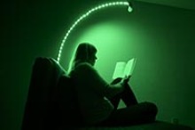 The green light is bright enough to allow for reading or exercise, for example, but no other light sources – such as from televisions, smart phones or computer screens – are allowed. (Photo: Kris Hanning/University of Arizona Health Sciences