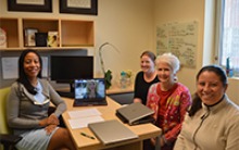Khadijah Breathett, MD (left), meets with members of her research team, including Natalie Pool, PhD, RN (on screen), Ashley Larson, Janice D. Crist, PhD, RN, and Erika Yee. (Photo: Katie Maass/University of Arizona Sarver Heart Center)