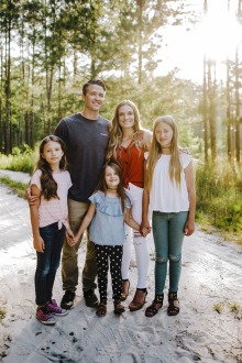 Ryan Sitton, MPH, with his wife and three daughters