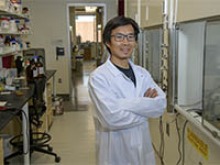 Jun Wang, PhD, is hoping to advance drug development for COVID-19 therapeutics by studying two compounds that inhibit key proteins involved in viral replication of SARS-CoV-2. (University of Arizona Health Sciences, Kris Hanning)